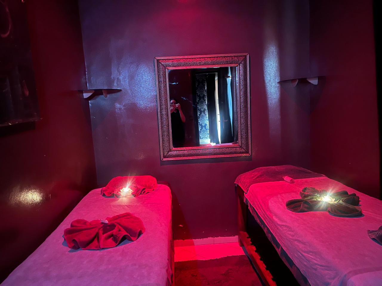 Luxury spa treatment setup with argan oil and fresh towels