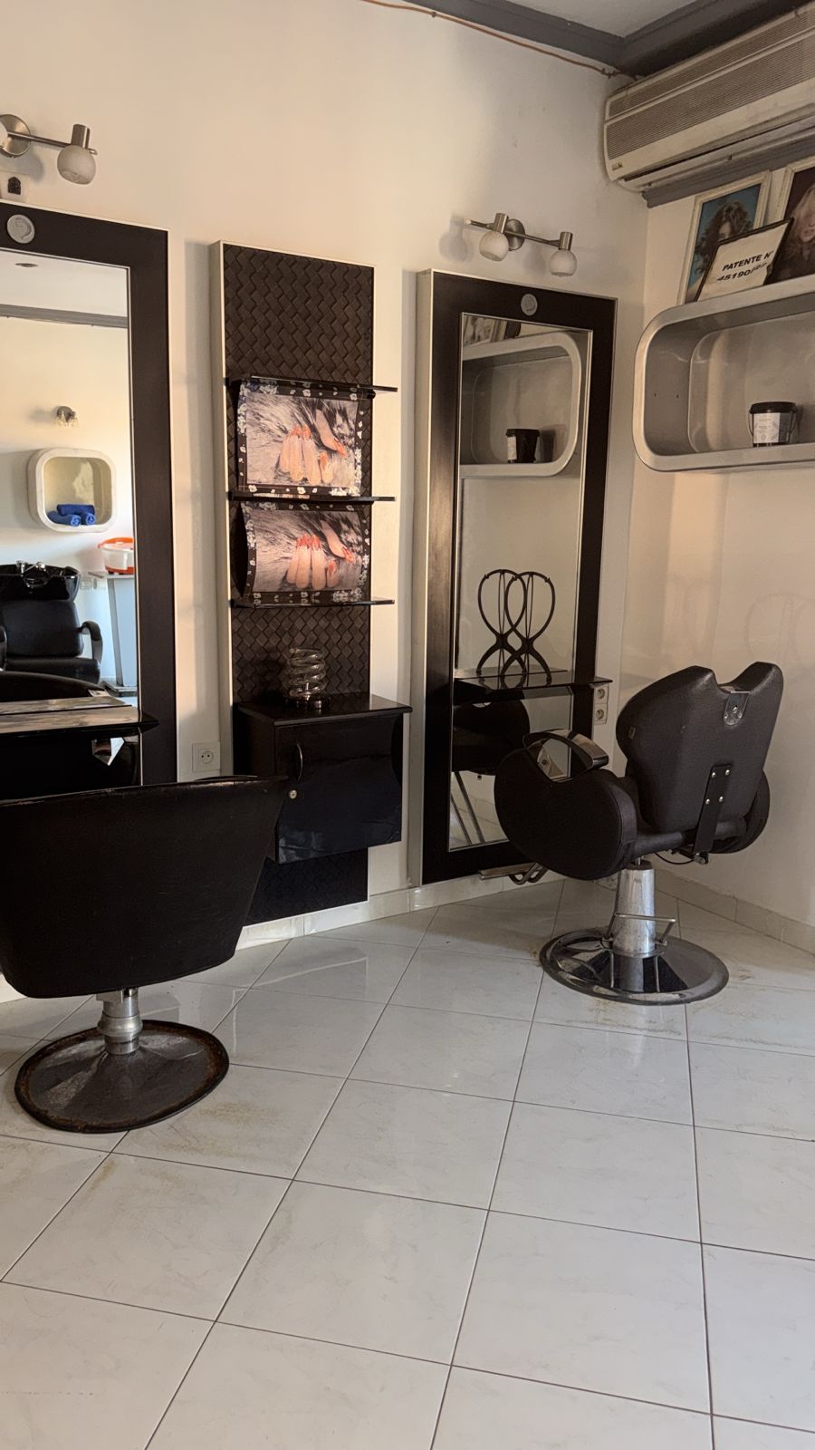 Luxury hair salon interior with modern styling stations at Vera Spa